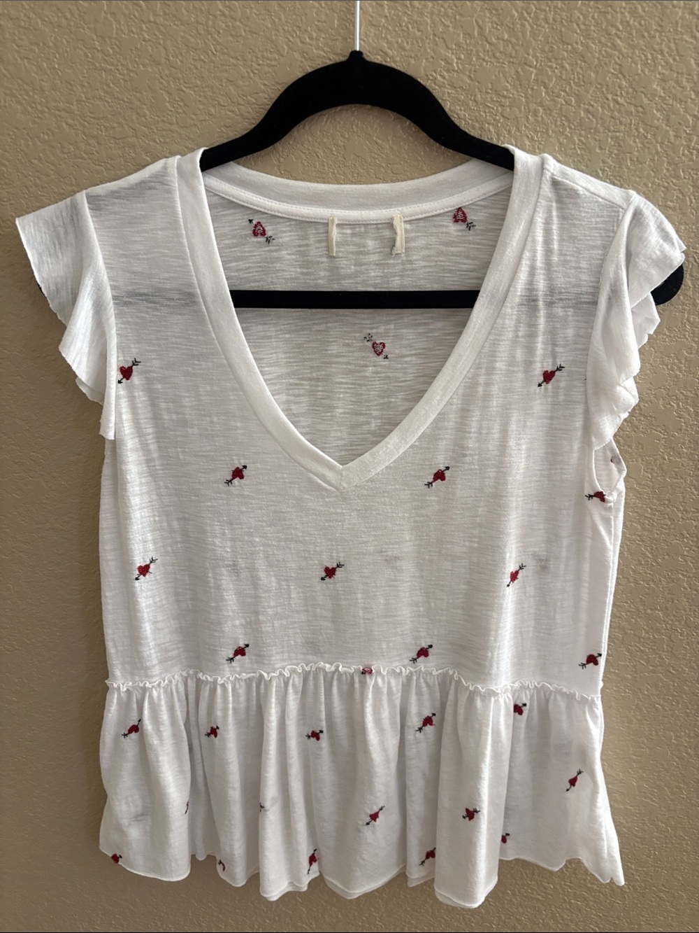 White V‑Neck Peplum Tunic with Red Embroidered Hearts